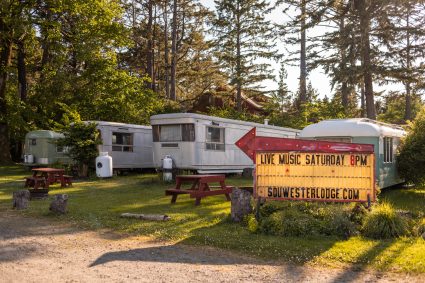 Restored vintage travel trailers among the trees at the Sou'wester
